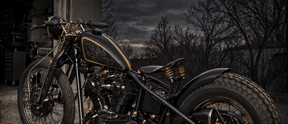 Black and gold custom motorcycle outside the Black Label shop